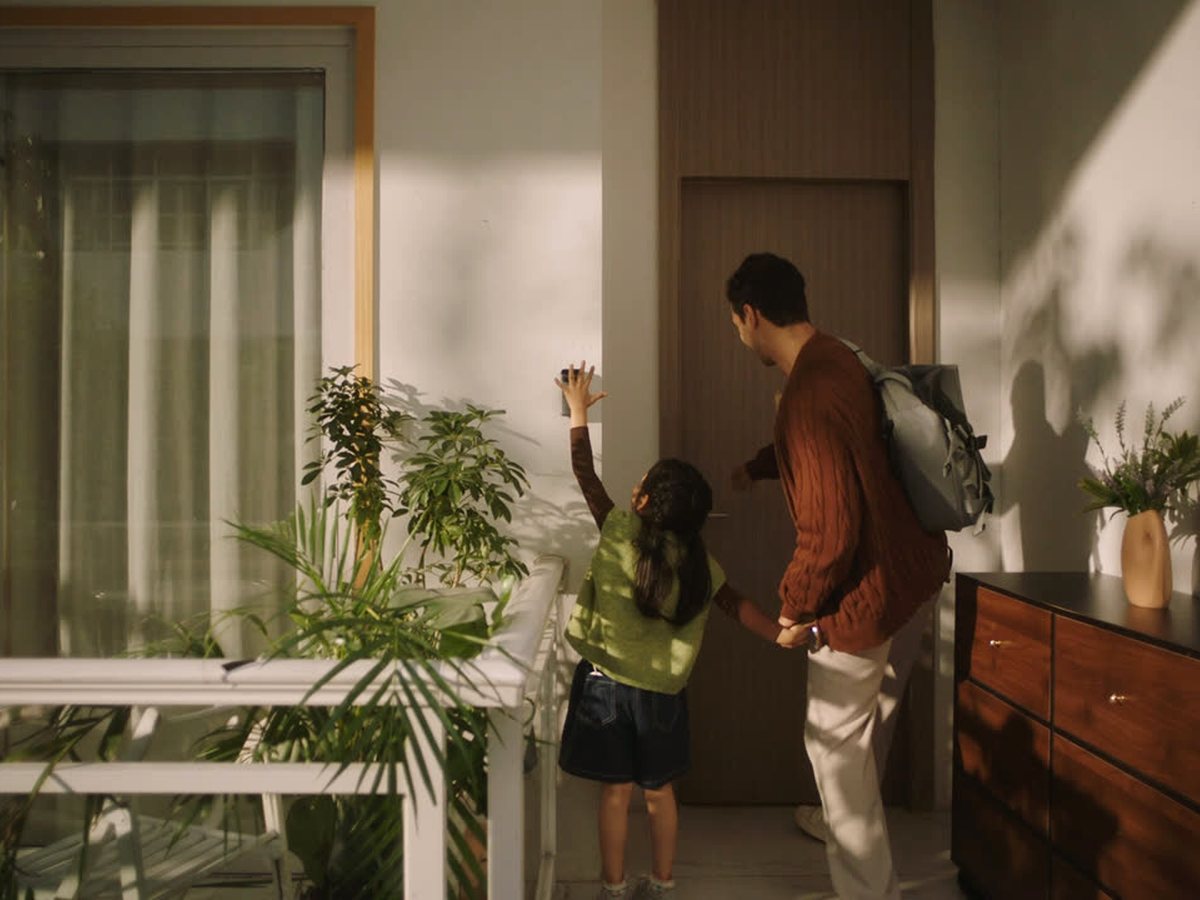 Family entering a condo with SwitchBot door access