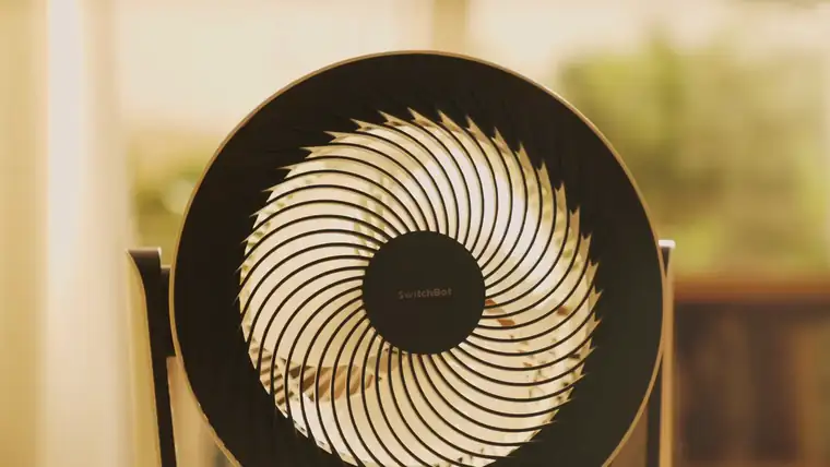 Battery Circulator Fan running beside a bright window