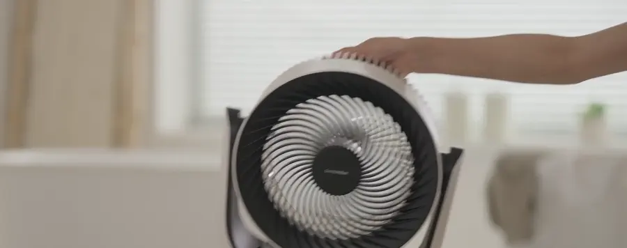 Battery Circulator Fan being moved by its built-in handle