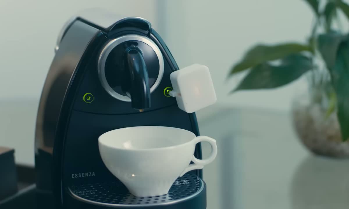 SwitchBot Bot pressing a coffee maker button