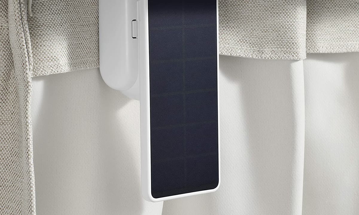 Solar Panel for Curtain 3 plugged into the curtain motor behind fabric curtains