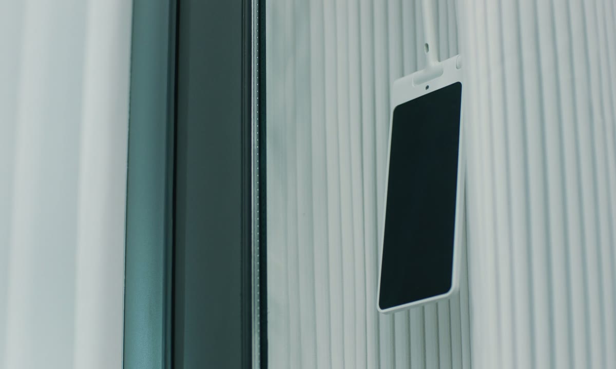 Curtain solar panel positioned near a bright window