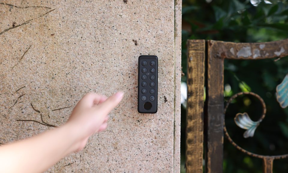 Keypad Touch mounted on an exterior gate wall while a PIN is entered
