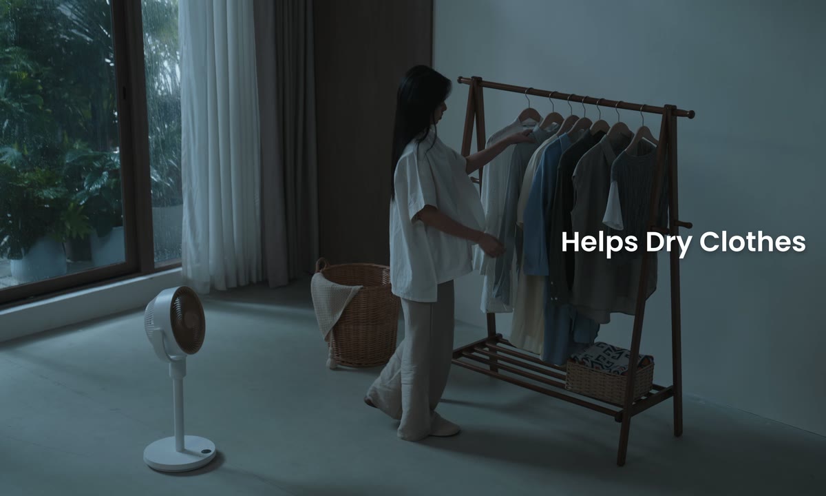 Standing Circulator Fan helping move air around indoor laundry