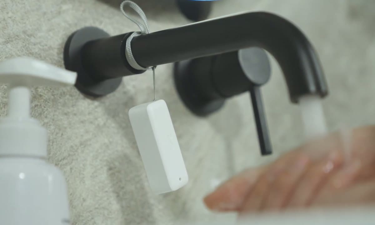 Thermo-Hygrometer hanging near a bathroom sink to monitor humidity